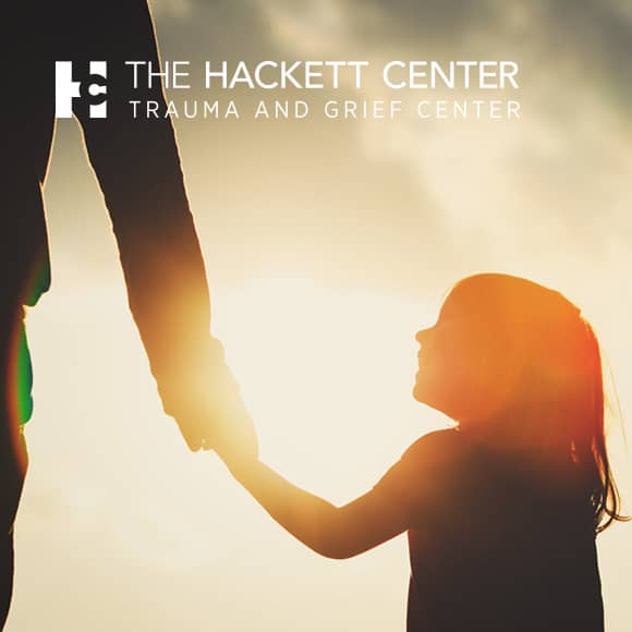 The Hackett Center trauma and Grief Center Banner White Logo