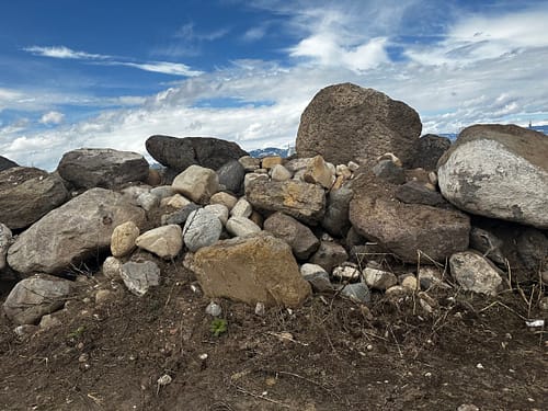 Darby Pit, Gravel & Trucking - We specialize in supplying top-quality materials such as dirt, sand, gravel, crushed stone, and landscaping rocks to meet all your construction and landscaping needs. Our comprehensive services also include professional trucking for excavation projects, home builders, and the development of roads, paths, driveways, and foundations.

Imagine a pile of boulders or beautifully crafted landscaping rocks resting on a patch of dirt under a partly cloudy sky—perfect for transforming any landscape project into a masterpiece. Whether you’re building a foundation or designing an elegant driveway or garden path, we provide everything you need to ensure success.