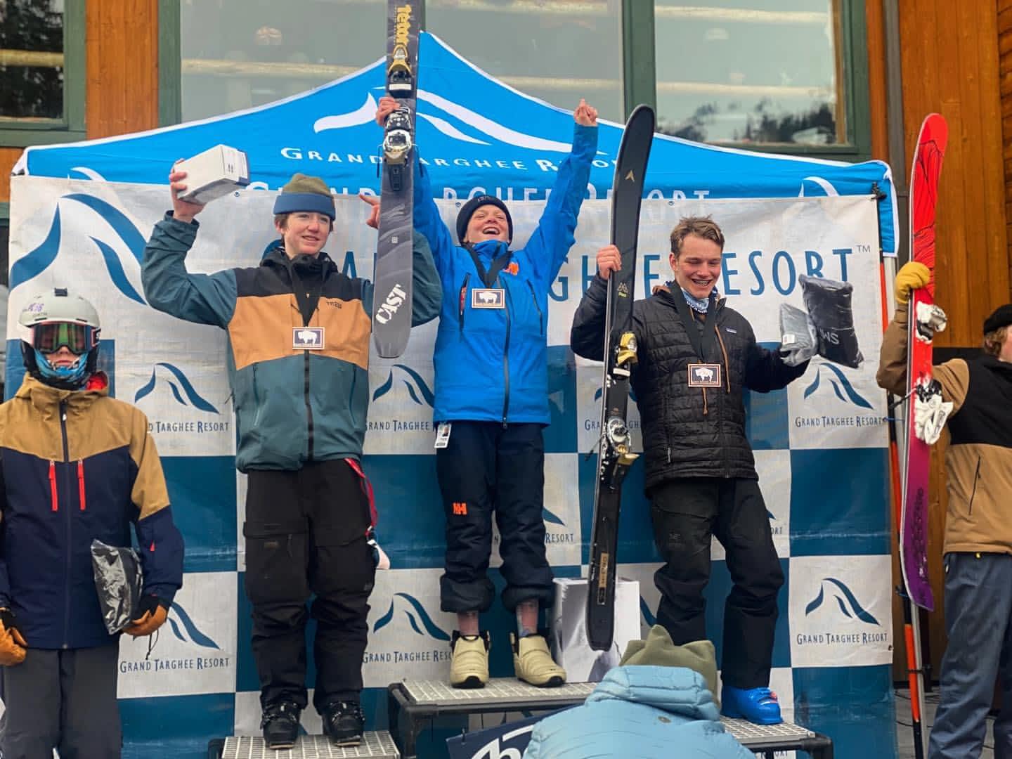 Grand Targhee Ski & Snowboard Foundation, Three delighted members of the Grand Targhee Ski & Snowboard Foundation stand proudly on a podium, clutching trophies in their winter gear. Positioned at the renowned Grand Targhee Resort, they exemplify excellence in winter sports education. Whether you're exploring Ski Idaho or participating in Wyoming ski team activities, our foundation is dedicated to fostering talent through dynamic programs like the Driggs and Victor ski teams. As a leading ski academy focused on developing future champions, we host thrilling snowboard events and freeride competitions that captivate audiences. Join us to celebrate achievements and experience premier freeride events that put athletes on the map in the world of competitive skiing and snowboarding!.