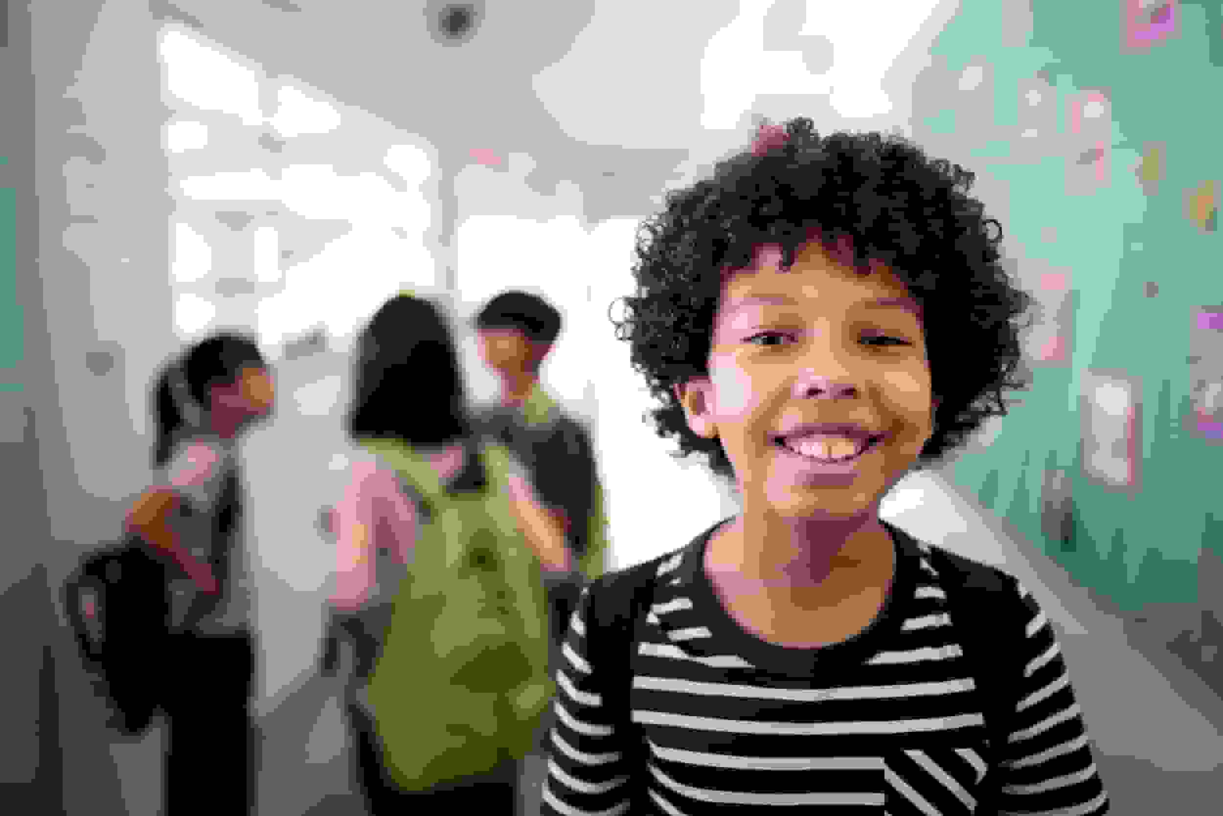 Portrait of a boy in the corridor at school