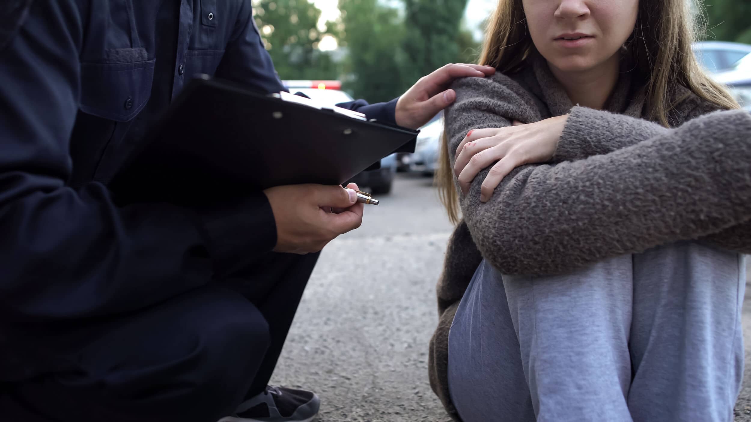 Officer Trying To Calm Down Female Victim Of Car Accident, Shocked Girl Crying