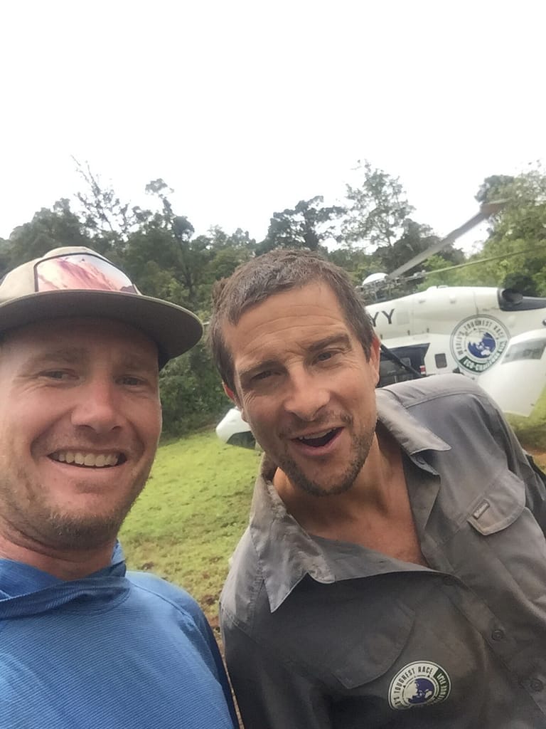 Eric Daft and Bear Grylls grinning at the camera in Fiji